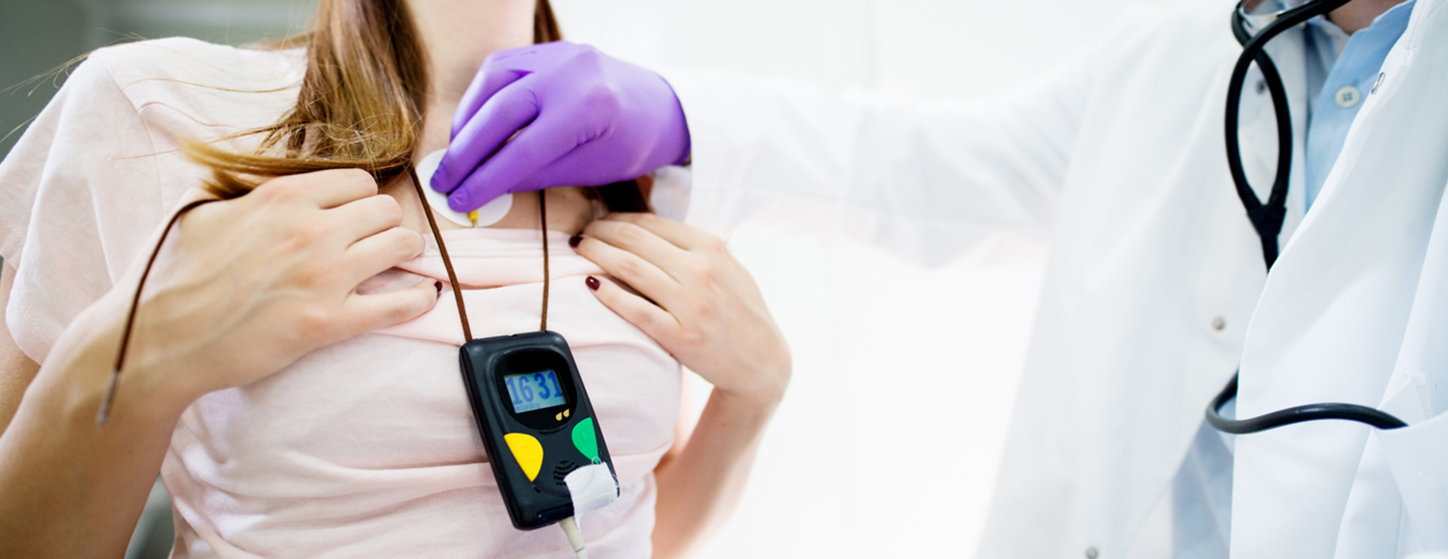 Patient having Holter monitor applied by clinician